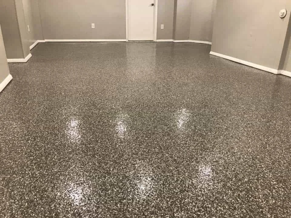Basement Floor epoxy with Shadow color flakes and polyaspartic top coat